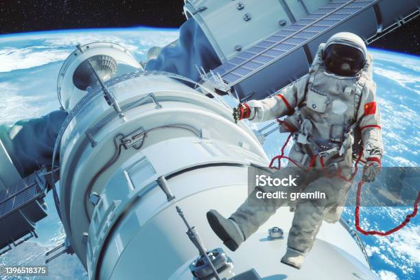 Chinese Astronaut Over The Main Module Tianhe On The Space Station Tiangong Stock Photo - Download Image Now