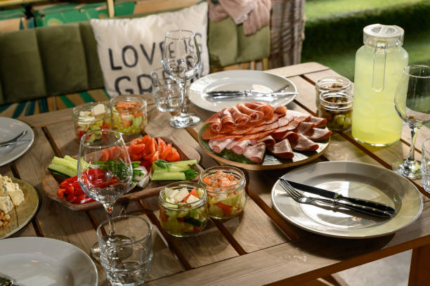 istock Wooden table with different types of snacks on holiday 1396524918
