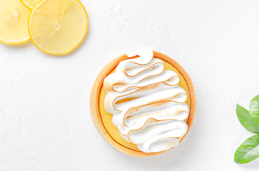 Lemon Pie on a white plate with lemon slice