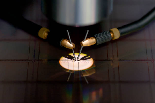 istock Close up of examining a sample of microchip transistor with probe station under the microscope in laboratory.A semiconductor on a silicon wafer. Selective focus. 1396526833