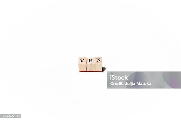 Isolate Of Wooden Letters Folded Into The Word Vpn Abbreviation Of The Word Virtual Private Network Stock Photo - Download Image Now