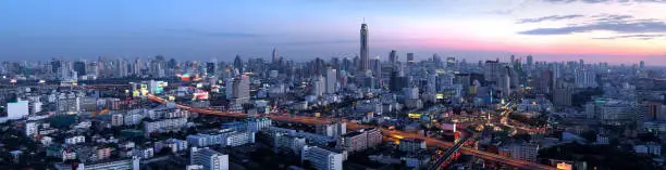 Photo of Aerial view panorama beautiful panoramic cityscape Bangkok business district and residential. In the twilight, Thailand