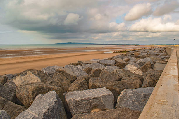 istock Clouds looming over an empty Camber Sands Beach 1396528425