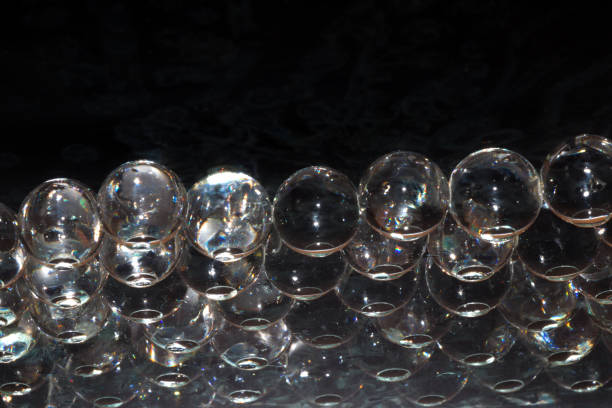 istock abstract 3d glass beads on black background, creative modern design 1396530420