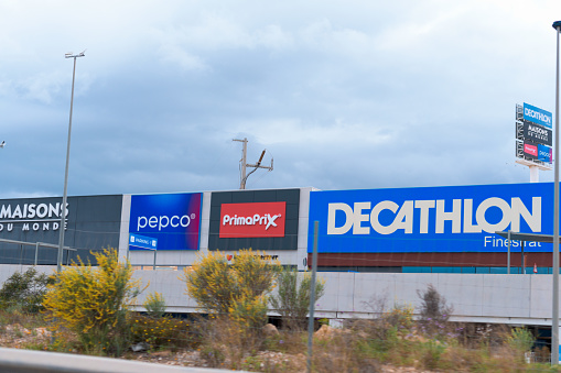 Finestrat, Alicante/Spain - May 04, 2022: Large billboards advertising Decathlon, PrimaPrix, PEPCO and Maisons du monde, in the shopping center \