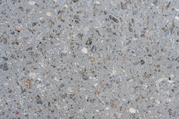 istock The background is gray concrete with gravel. Close-up texture 1396531479
