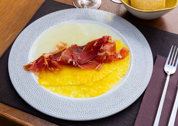 istock Carpaccio of pineapple and melon carpaccio with thinly sliced prosciutto 1396534168