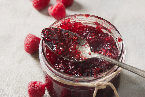 composition from a blackberry and raspberry on the white isolated background