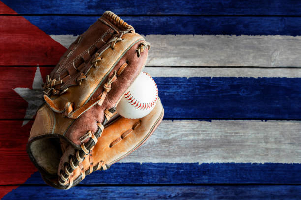 istock Leather Baseball Glove With Ball on Painted Cuban Flag 1396534727