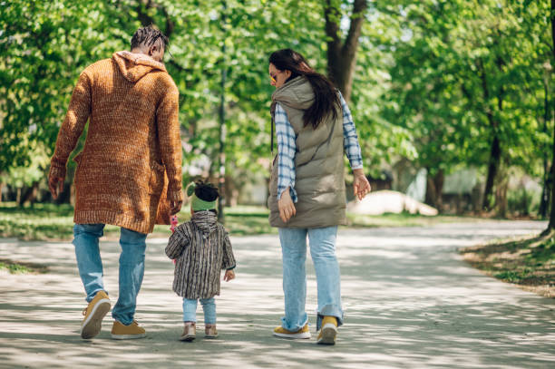 istock Multiracial family having fun in the park 1396538152