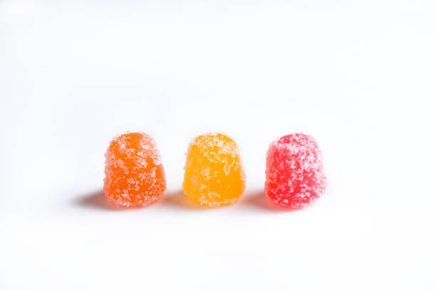 Three CBD gummy candy gumdrops on a white background stock photo