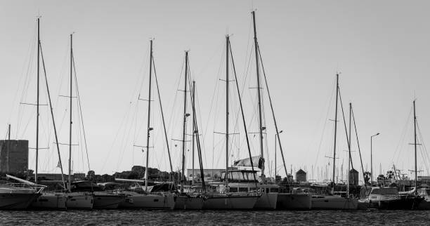 istock Boat masts in row in a sunny day.in Black and white. 1396541378