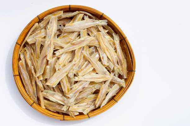 istock Dried anchovies on white background. 1396541444