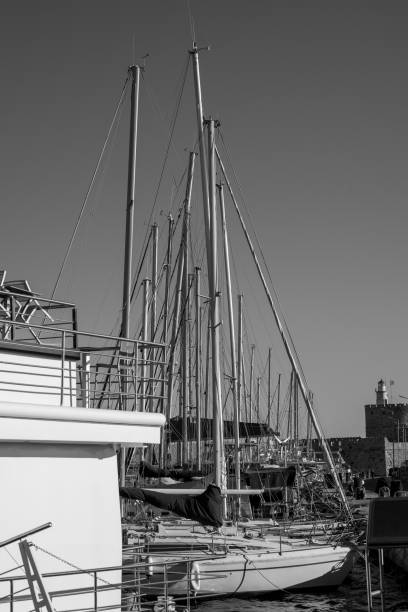istock Boat masts in row in a sunny day.in Black and white. 1396541490