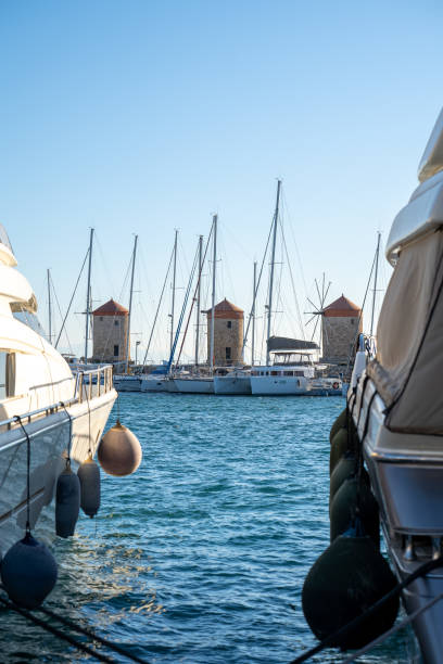 istock Windmills in Mandraki Harbor in Rhodes Greece 1396541492