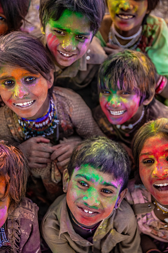 Group of Indian children playing happy holi. Holi, the festival of colors, is a religious festival in India, celebrated, with the color powders, during the spring.