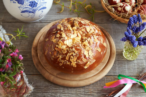 istock Mazanec, traditional Czech sweet Easter pastry, with spring flowers and Easter eggs 1396548194
