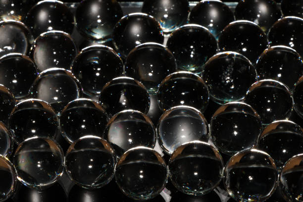 3d glass balls on a black background transparent beads