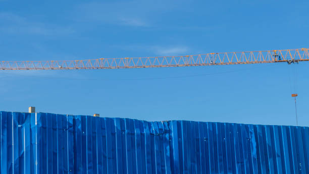 istock New pedestrian bridge construction over river in city. Construction site. Blue sky. 1396552670