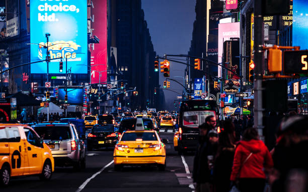 istock Times Square traffic by night, New York City 1396553802