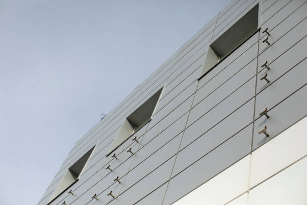istock Modern building is gray in color. Facing panel on office building. 1396555402