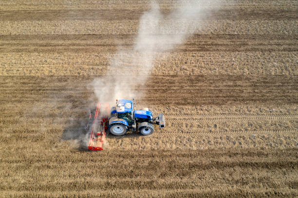 istock Tractor Working on Field, Aerial View 1396556025