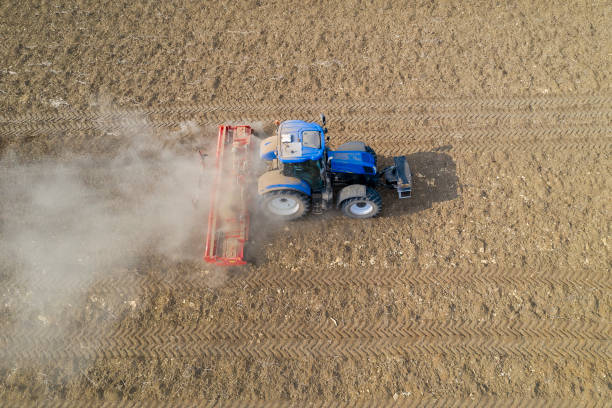 istock Tractor Working on Field, Aerial View 1396556246