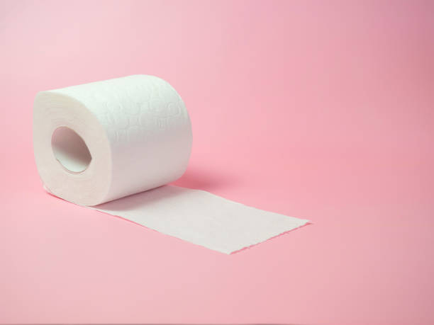 istock Toilet paper roll on pink background, Space for text 1396557076