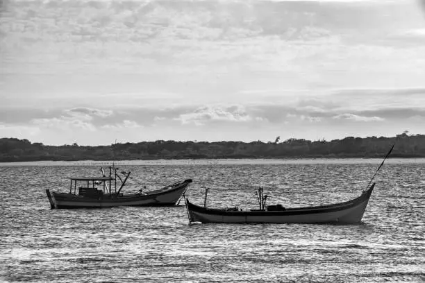 Fishing boats moored in front of Superagui beach in the state of Paraná on the south coast of Brazil