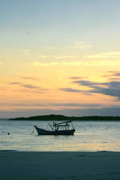 Fishing boat moored in front of Superagui beach in the state of Paraná on the south coast of Brazil