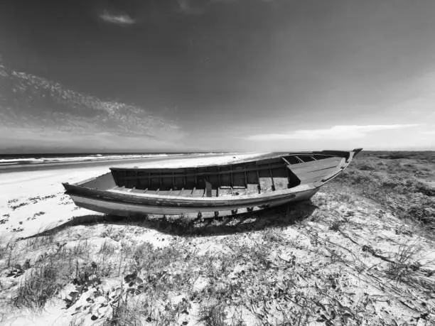 Wrecked fishing boat on the beach of Superagui on the south coast of Brazil