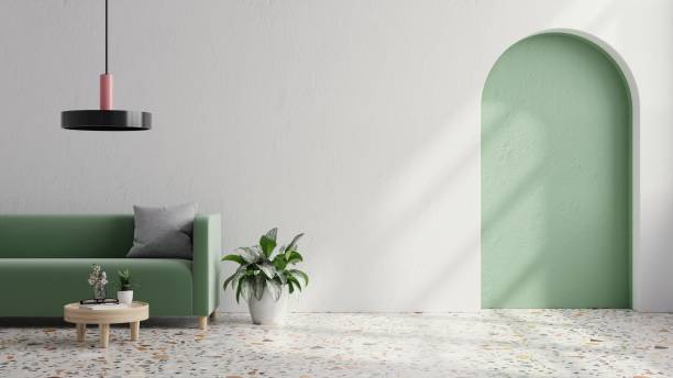 istock Green sofa with table on green wall and white wood flooring. 1396570558