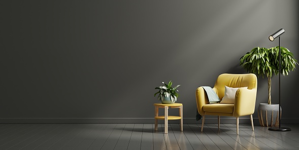 Interior wall mockup in dark tones with yellow armchair on black wall background.3D rendering