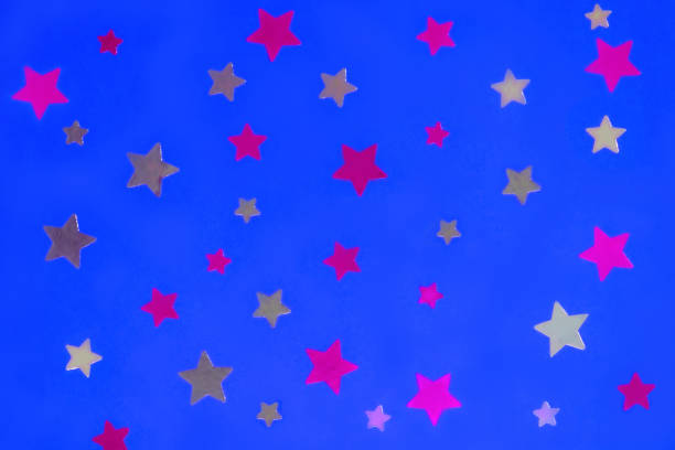 Gold and silver stars on red background. Abstract decoration for party, birthday celebrate, event, festive. Festival stars decor.