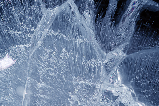 blue ice with cracks. frosty background