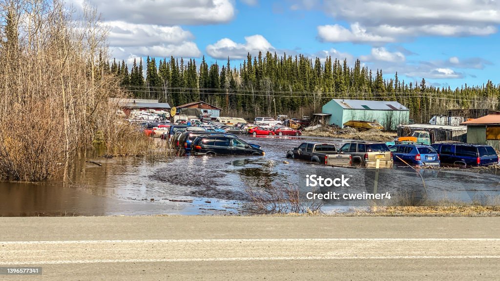 Flooding in  Glennallen, Alaska After a record year of snow, in which all known records were broken, the spring season is cause another issue. Snow melt is causing a path of destruction as water makes its way down mountains on. Path of least resistance. Alaska - US State Stock Photo