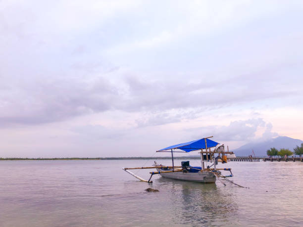 istock Fishing boat with a beautiful mountain view 1396579760