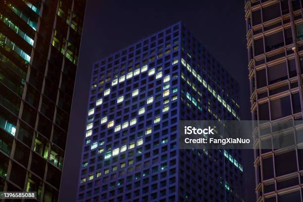 Happy Face Shape In Lights In Downtown District Office Business Buildings At Night Stock Photo - Download Image Now