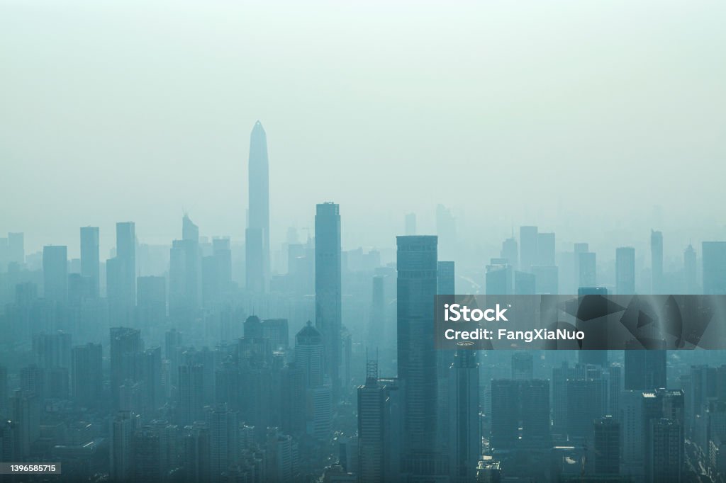 Cityscape of office buildings in Shenzhen's financial area Futian District, China, poor bad air quality fog Cityscape of office buildings in Shenzhen's financial area Futian District, China Dystopia - Concept Stock Photo
