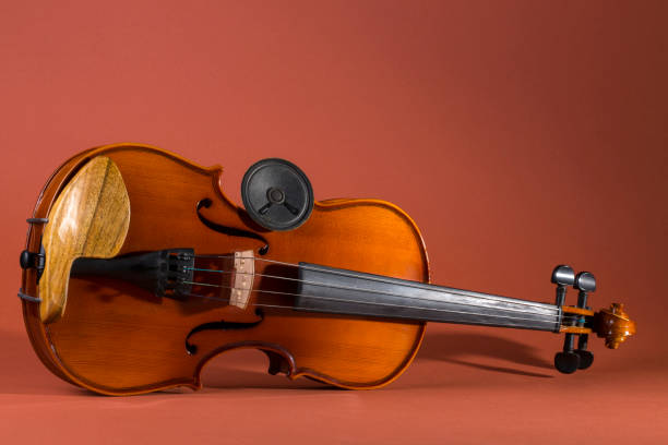 istock Still life with a violin and a small acoustic speaker 1396587122