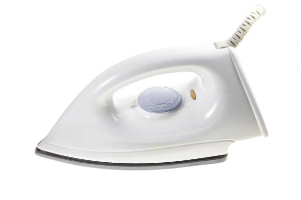 istock white electric iron on a white background. 1396588115
