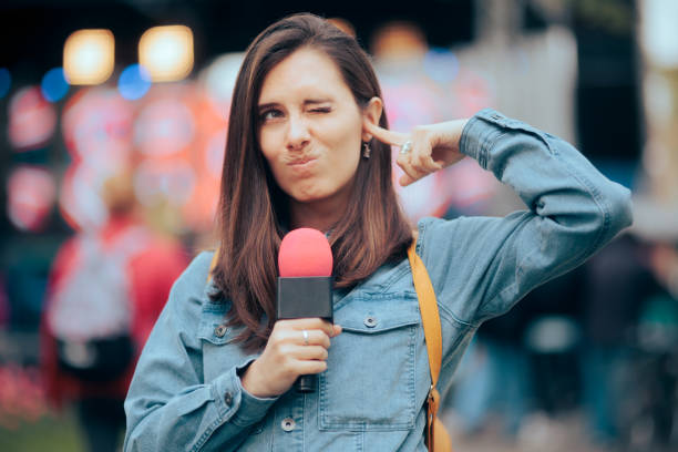 istock Reporter Standing Outside Not Hearing from Loud Noise 1396590679