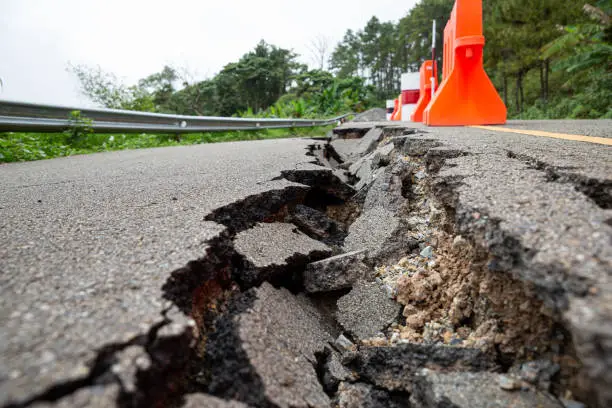 Photo of Cracked road after the earthquake, non-standard construction.