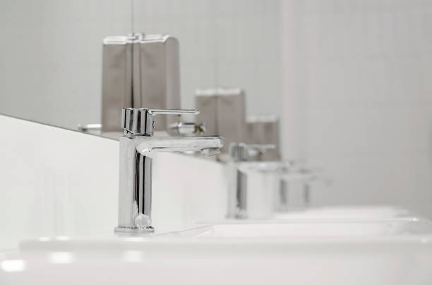 istock Bathroom interior with sink and faucet. Close-up, selective focus. 1396600079