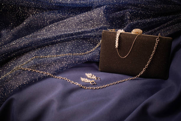istock black clutch with jewelry on background blue cloth 1396601229