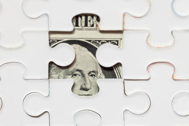 istock US Dollar Banknote with Jigsaw Puzzle Mask 1396603215