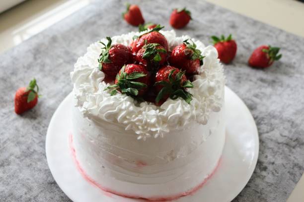 istock Strawberry short cake on a white plate. 1396603540