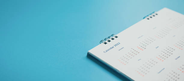 istock Close top view on white calendar 2022 month schedule Work planning and life concept. 1396604446