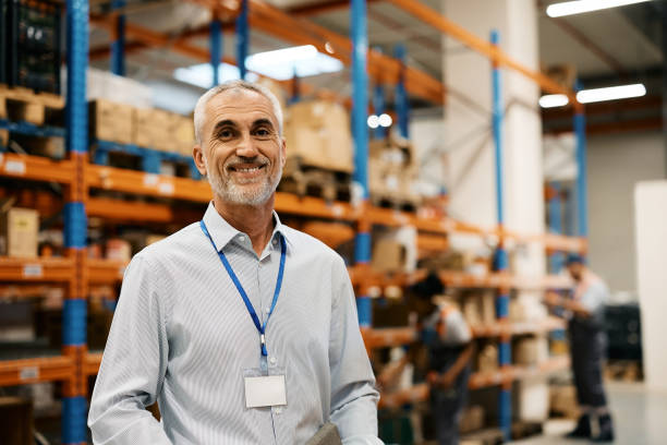 istock Portrait of happy senior warehouse manager looking at camera. 1396606536