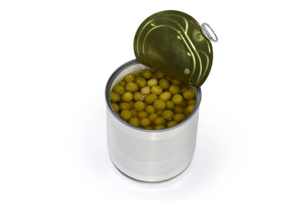 istock Canned green peas in the open round tin can 1396607319